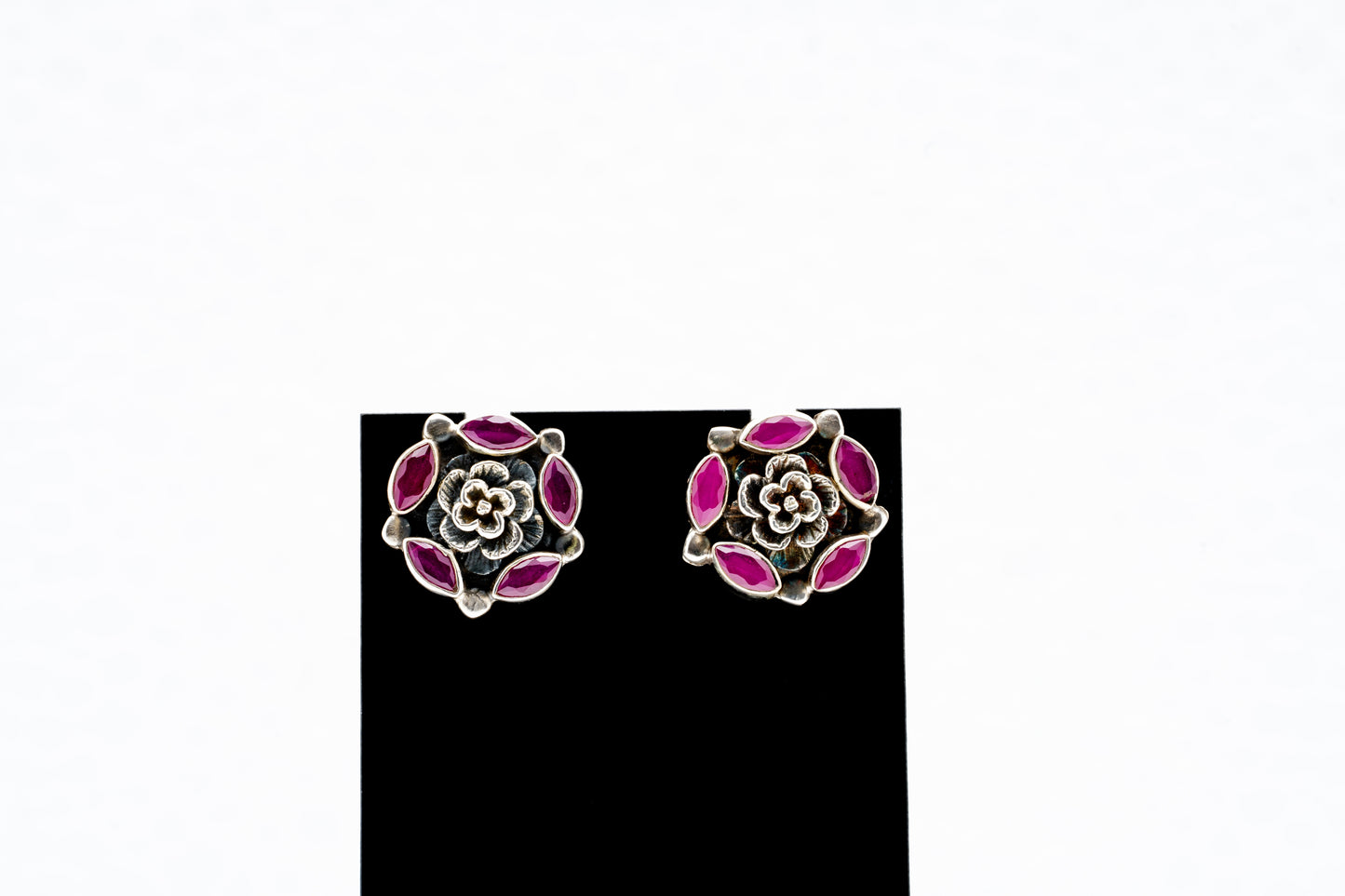 Floral silver earrings with purple stones