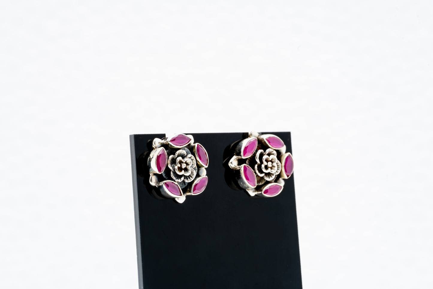 Floral silver earrings with purple stones