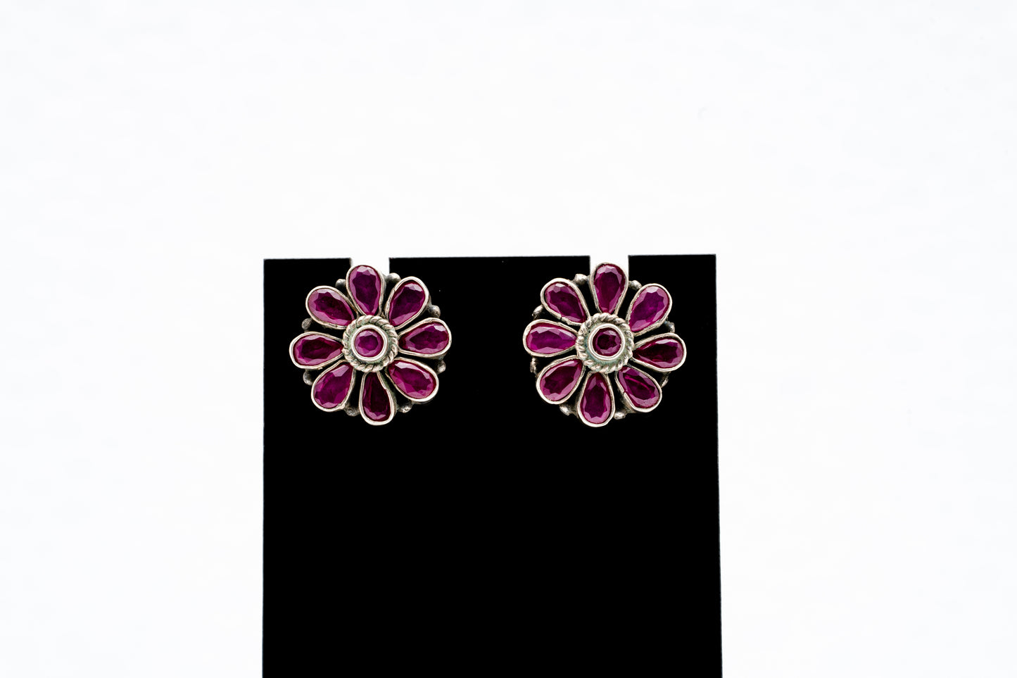 Floral silver earrings with purple stones