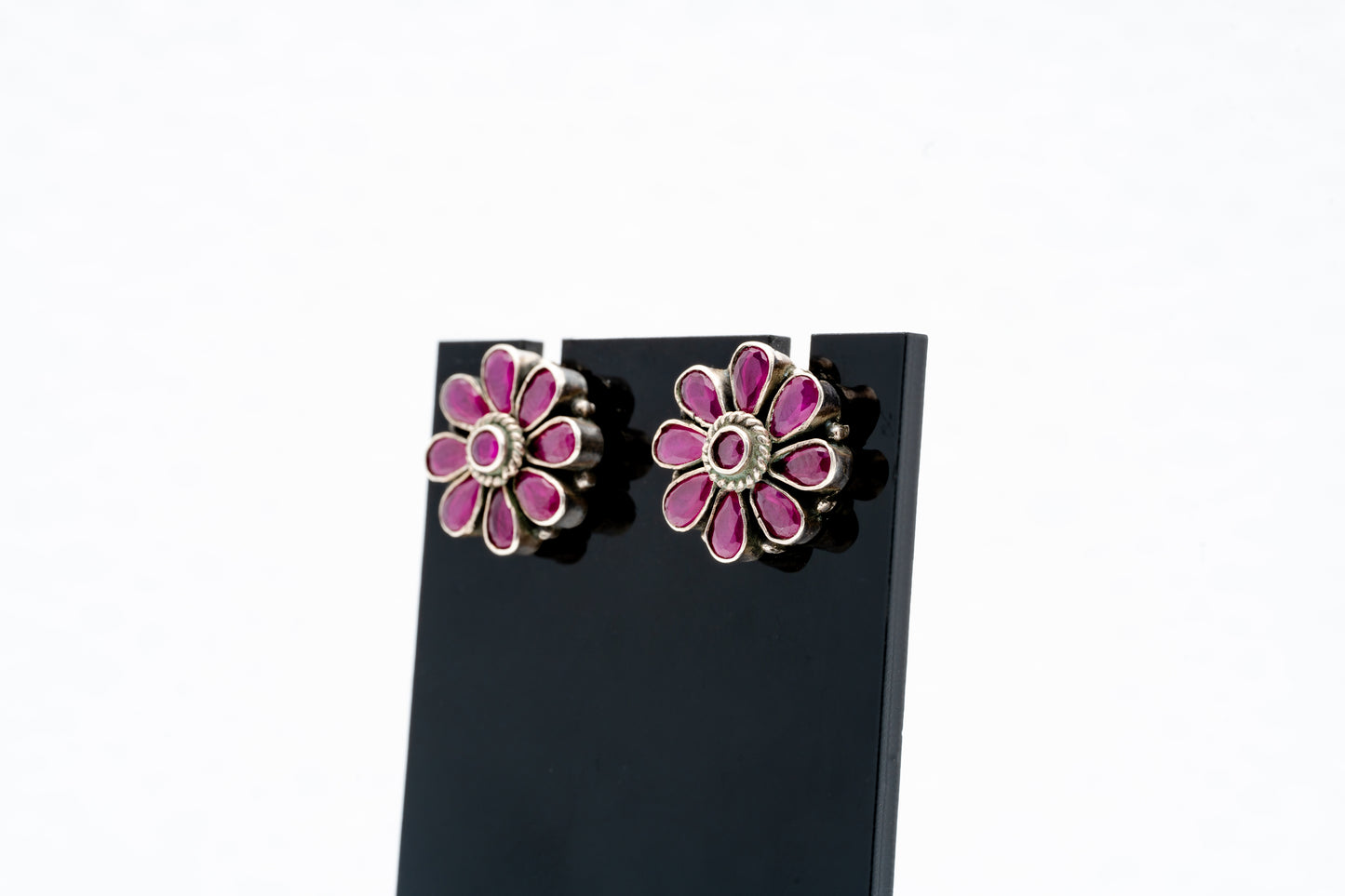 Floral silver earrings with purple stones