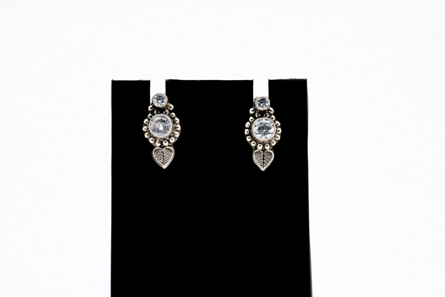 Tiny leaf hanging silver earrings